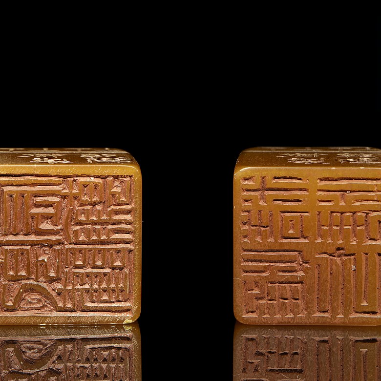 Pair of stone stamps, 20th Century