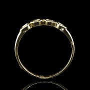 Anillo de oro amarillo 18 k con cuatro brillantes