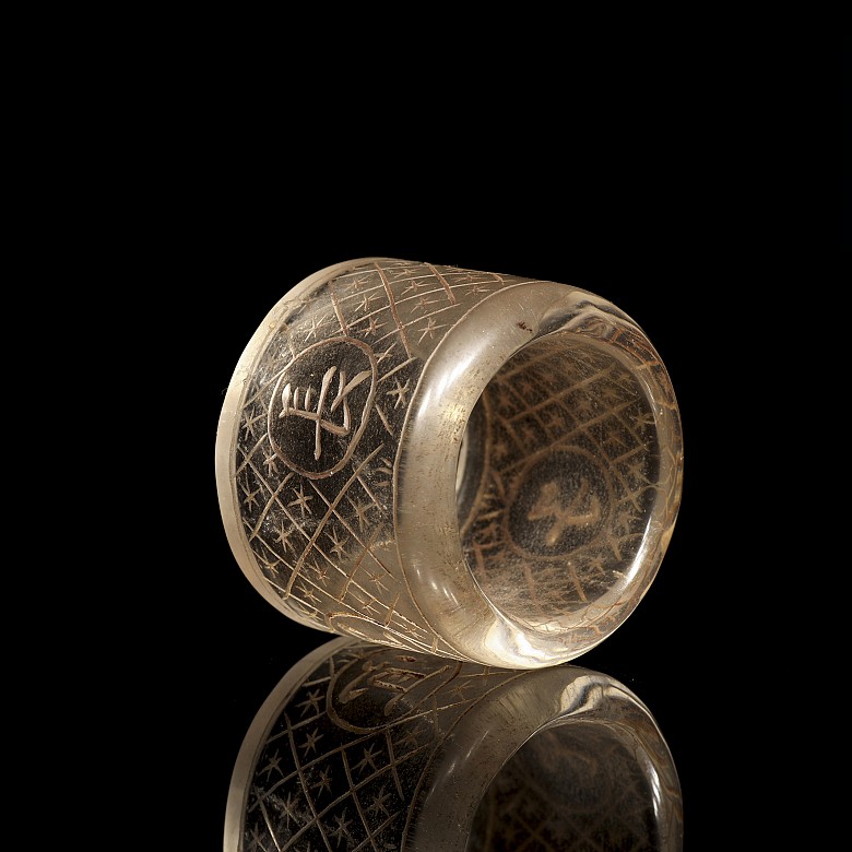 Carved quartz ring with characters, 20th century