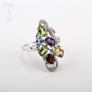 18k gold ring with five color gems and diamonds.