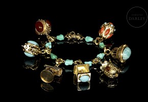 Yellow gold bracelet with pendants and coloured stones