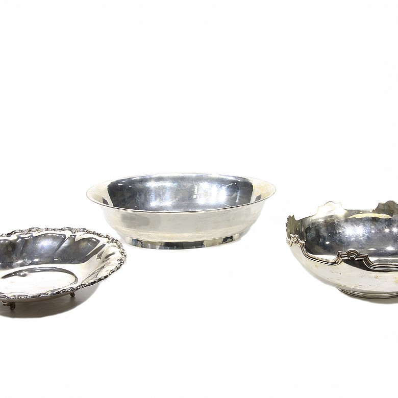 Three small silver trays.