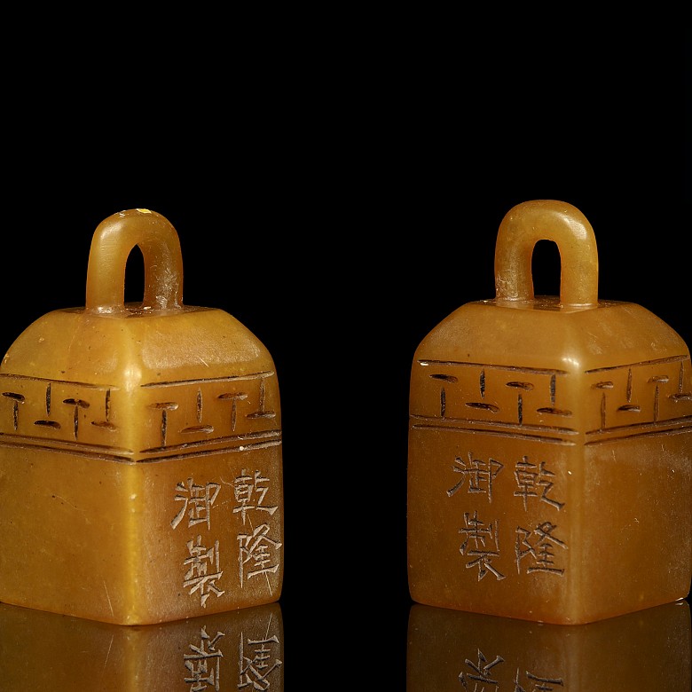 Pair of stone stamps, 20th Century