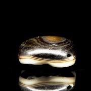 Three-coloured agate ‘Dzi’ bead with lotus petals, Ming dynasty