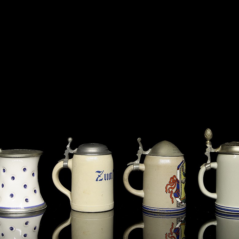 Four earthenware beer steins, 20th century