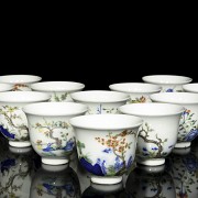 Complete set of twelve cups with flowers, 20th century