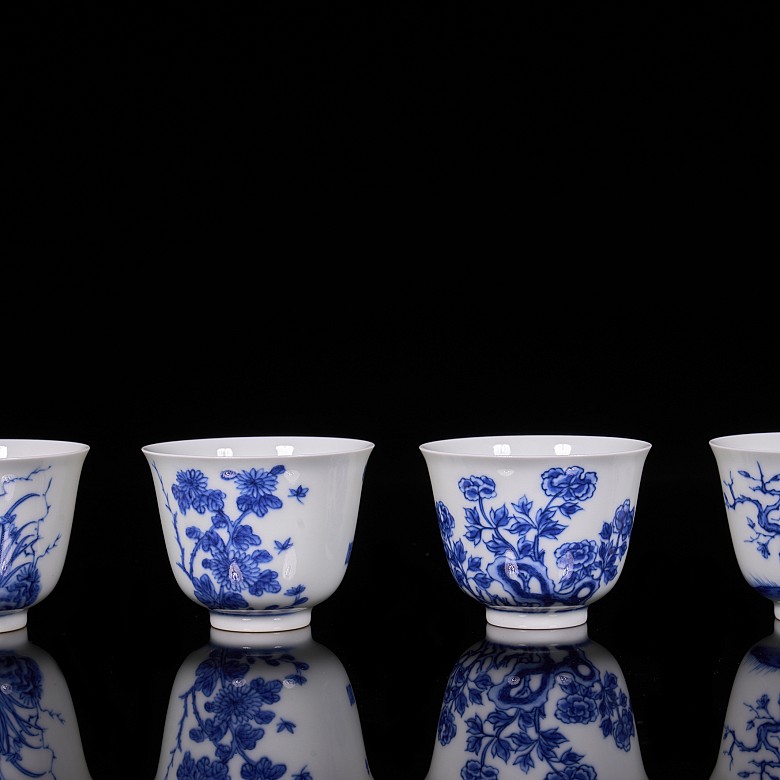 Set of twelve blue and white porcelain mugs, 20th century