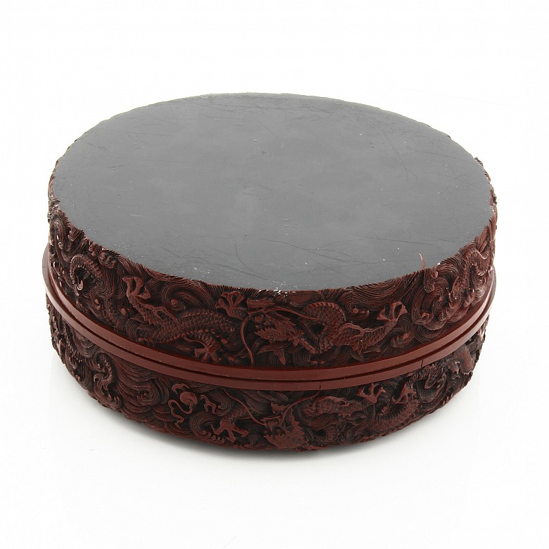 A carved cinnabar lacquer 