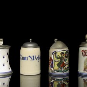 Four earthenware beer steins, 20th century