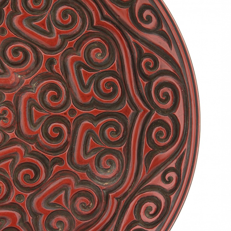 A large carved cinnabar lacquer dish, China, Qing Dynasty.