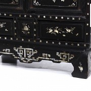 A Chinese lacquered cabinet with mother-of-pearl inlays, Qing dynasty.