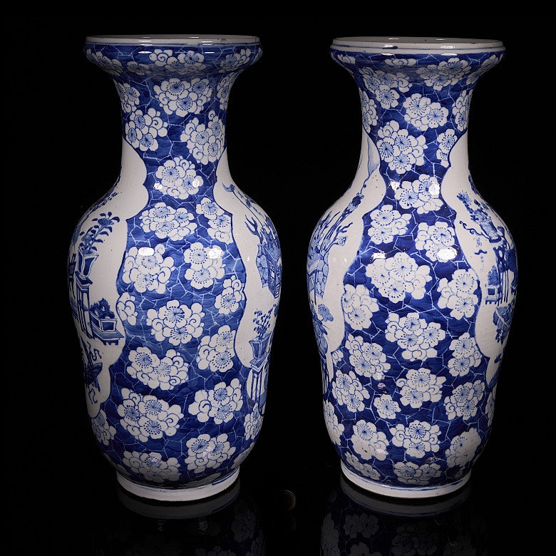 Pair of blue and white ‘Scenes and Plum Blossom’ vases, Qing Dynasty