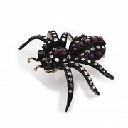 Silver brooch in the shape of a spider.