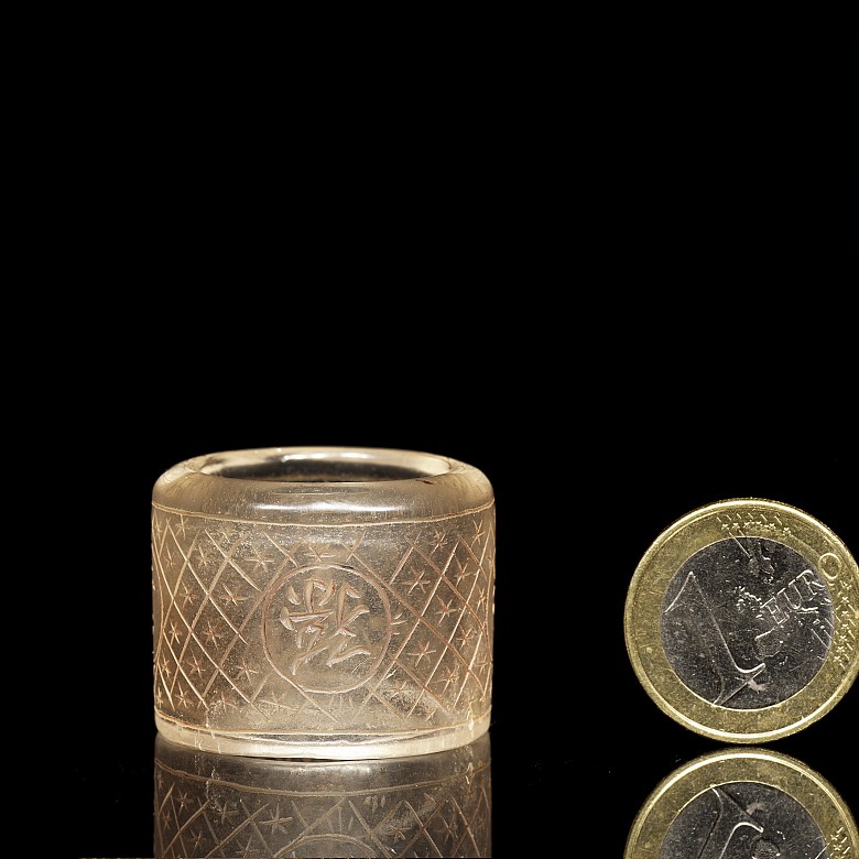 Carved quartz ring with characters, 20th century