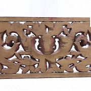 Carved wooden lintel with acanthus scrolls, Bali, Indonesia.