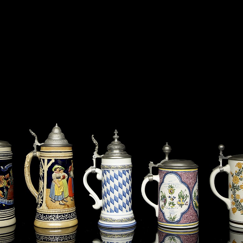 Five glazed ceramic beer steins, 20th century