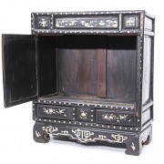 A Chinese lacquered cabinet with mother-of-pearl inlays, Qing dynasty.