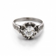 18k white gold solitaire ring with diamonds.