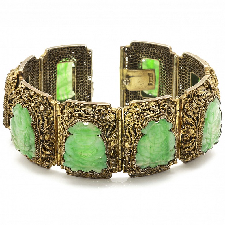 A Silver bracelet with jade plaques.