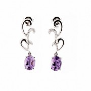 Earrings in 18k white gold, with amethysts and diamonds.