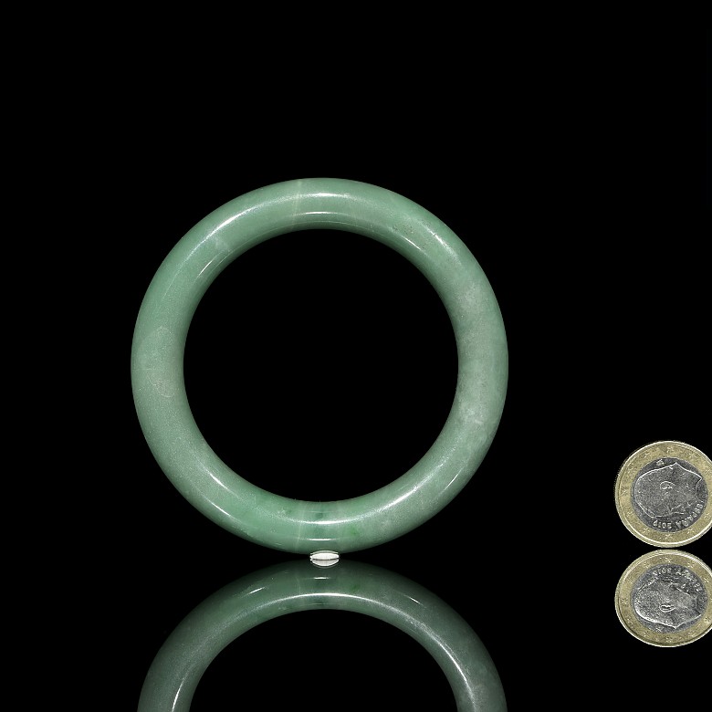 Carved green jadeite bangle, 20th century