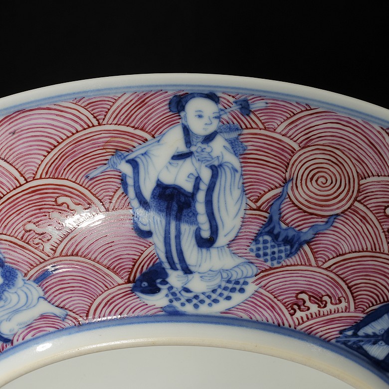 Porcelain plate in red, blue and white ‘The Eight Immortals’, with Qianlong trademark