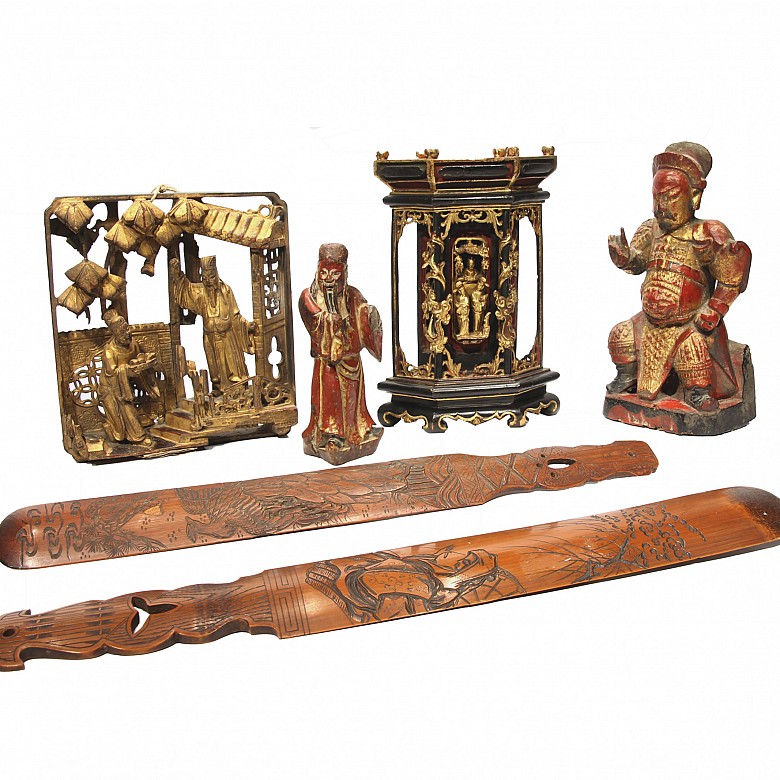 An antique polychrome carved wood group of six figures.