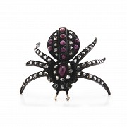 Silver brooch in the shape of a spider.