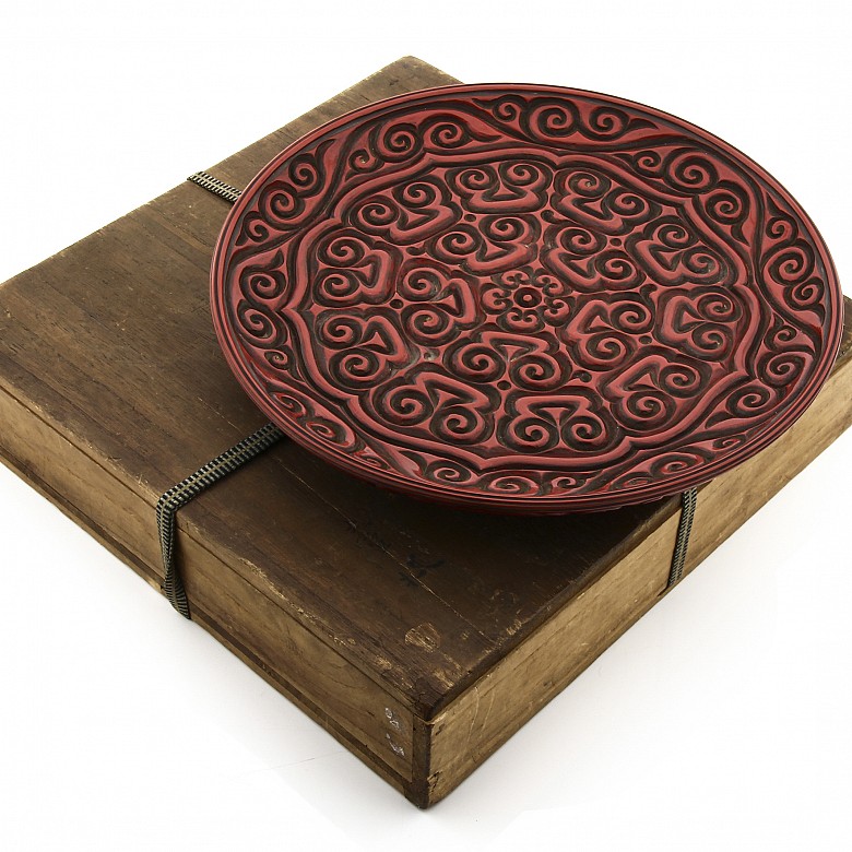 A large carved cinnabar lacquer dish, China, Qing Dynasty.