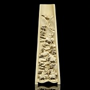 A carved ivory wrist rest, 19th century