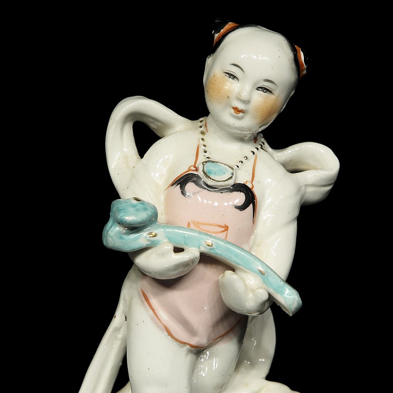 Pair of porcelain children, 20th century