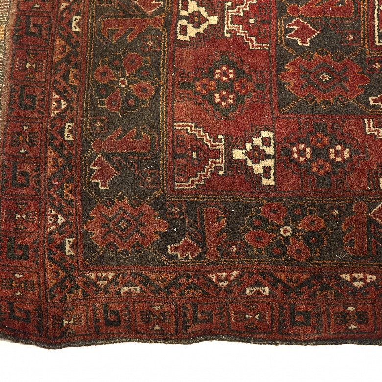 Small Persian woollen carpet, 20th century