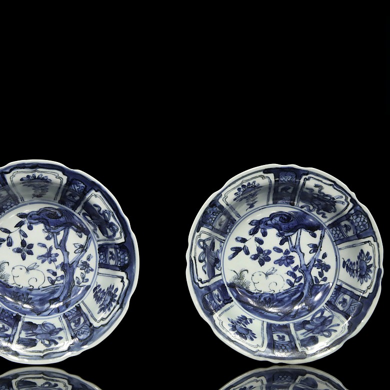 Pair of plates, blue and white, with landscapes, 20th century