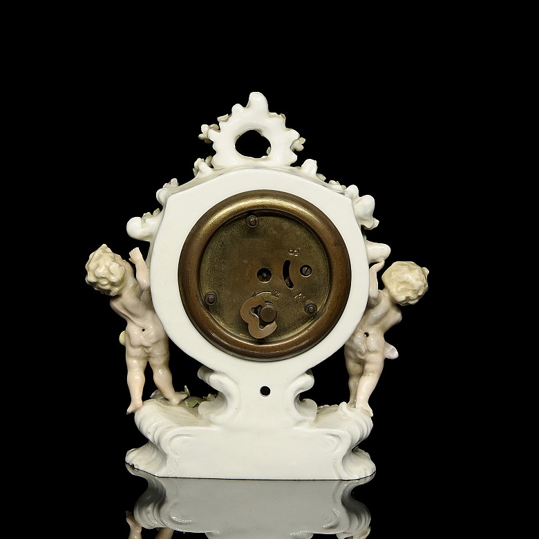 German porcelain clock ‘Infants’, 20th century