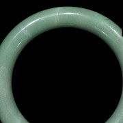 Carved green jadeite bangle, 20th century