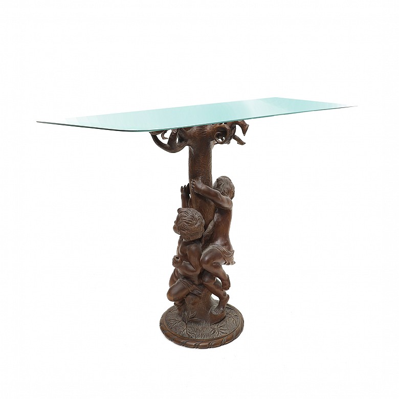 Vicente Andreu. Table console with carved wooden base and glass top, 20th century.