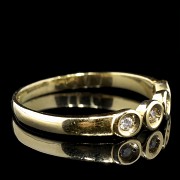 Anillo de oro amarillo 18 k con cuatro brillantes