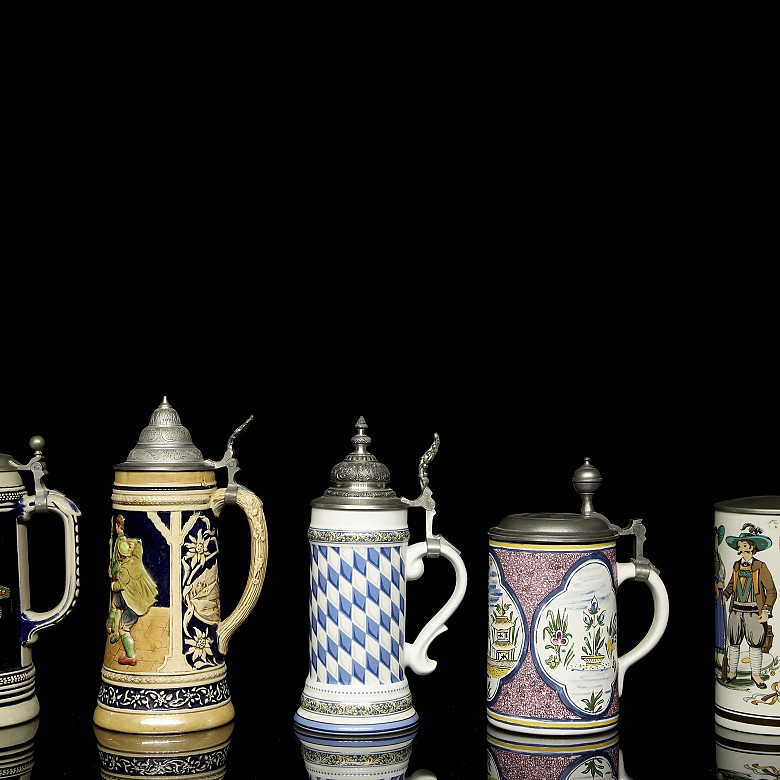 Five glazed ceramic beer steins, 20th century