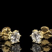 Pendientes de oro amarillo 18 k y brillantes 0,60 ct.