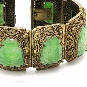 A Silver bracelet with jade plaques.