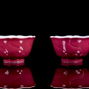 Pair of enamelled porcelain cups ‘Lotuses’, with Yongzheng mark