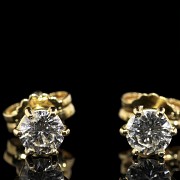 Pendientes de oro amarillo 18 k y brillantes 0,60 ct.