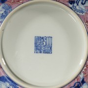 Porcelain plate in red, blue and white ‘The Eight Immortals’, with Qianlong trademark