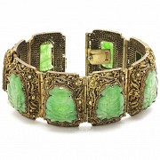 A Silver bracelet with jade plaques.