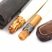 Two mouthpieces in meerschaum, amber and silver, 19th century