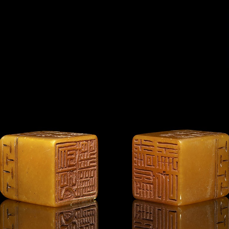 Pair of stone stamps, 20th Century