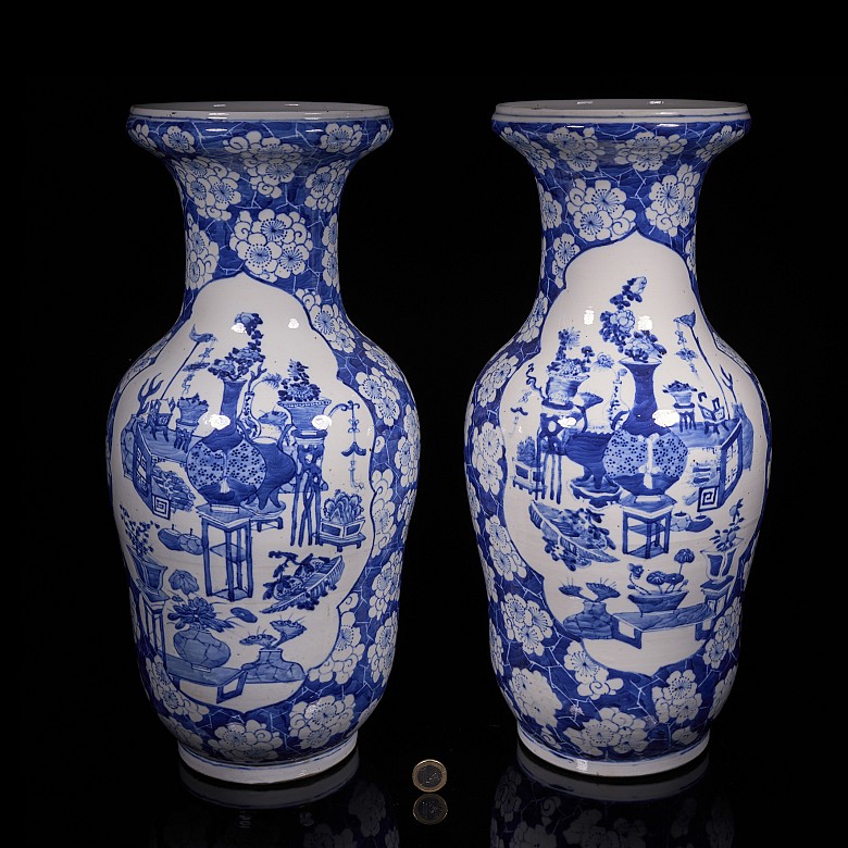 Pair of blue and white ‘Scenes and Plum Blossom’ vases, Qing Dynasty