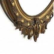 Carved and gilded wooden mirror, 20th century