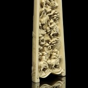 A carved ivory wrist rest, 19th century