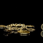 Gold bracelet with coins and charms